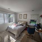 bedroom with custom window treatments