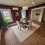 dining room with wide plank hardwood flooring
