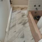 new marble tile flooring installed in a bathroom