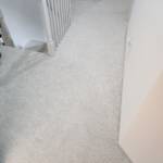 white carpet in an upstairs hallway