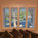 custom window shutters in a family room